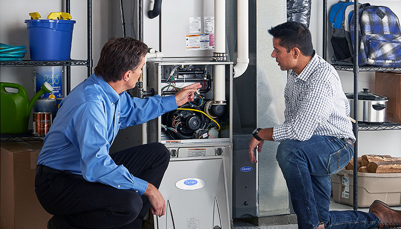 Technician evaluating a furnace for repair or replacement in Vacaville