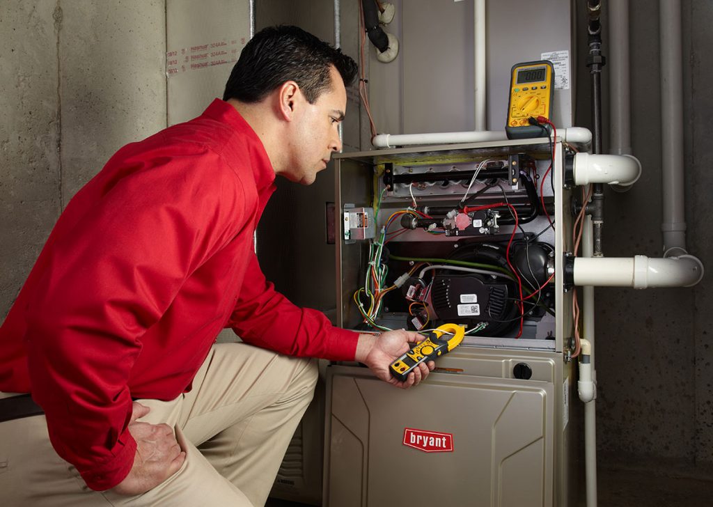Heating technician diagnosing a furnace repair in Vacaville
