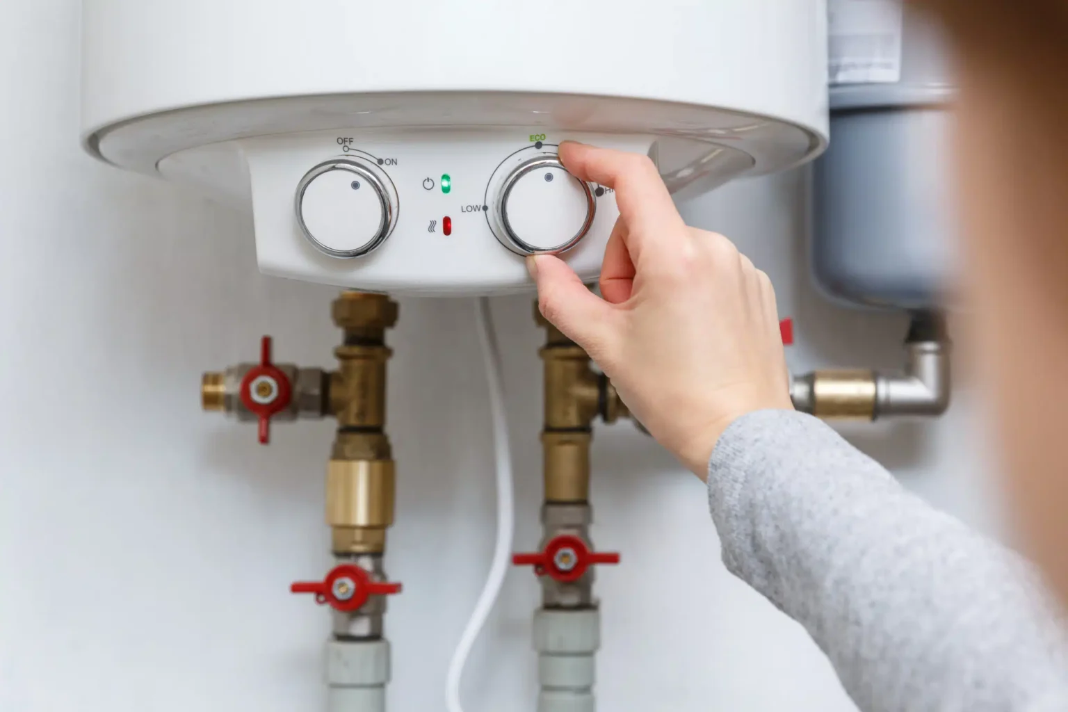 Technician adjusting a water heater in Vacaville