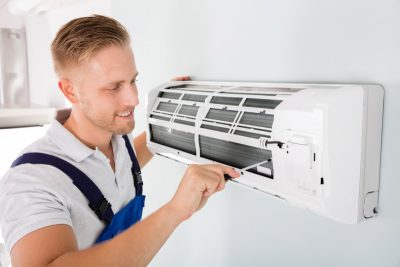 Ductless AC Maintenance Vacaville HVAC technician maintaining a ductless air conditioner in Vacaville