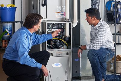 Furnace Repair or Replacement Vacaville Technician evaluating a furnace for repair or replacement in Vacaville