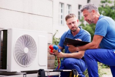 Outdoor AC Installation Vacaville HVAC technicians installing an outdoor air conditioning unit in Vacaville