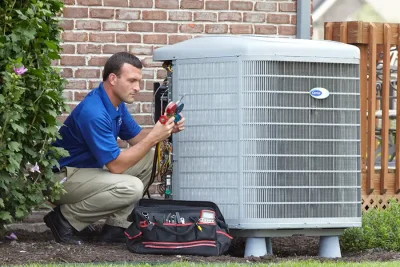 Outdoor AC Unit Inspection Vacaville HVAC technician inspecting an outdoor AC unit in Vacaville
